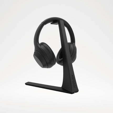 Suport de căști Kanto Audio H3, negru, cu căști over-ear, pe fundal gri deschis