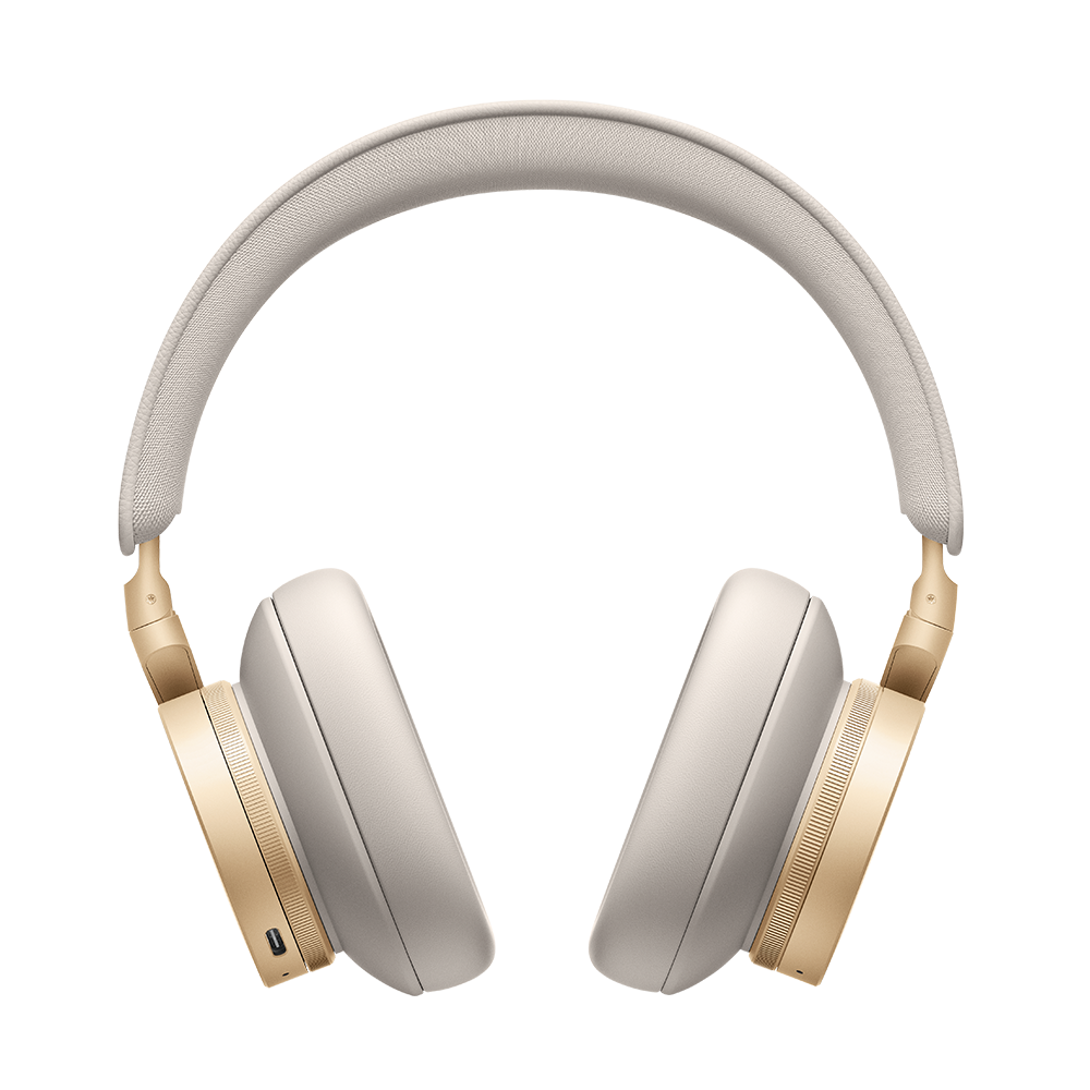 Beoplay H95 în finisaj Gold Tone, pe fundal neutru.