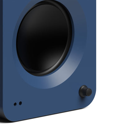 Boxe active Kanto Audio REN albastre, detaliu cu butonul de volum și wooferul